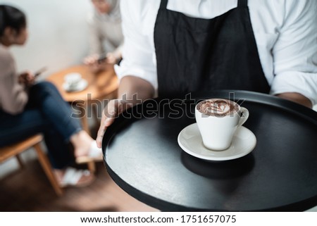 Similar – Image, Stock Photo Crop Asian waitress serving burger in cafe