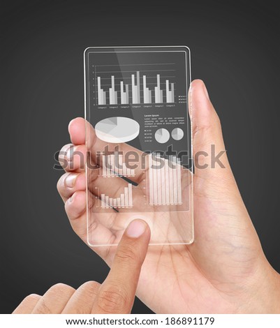 image of hands holding futuristic transparent mobile phone. business chart financial concept