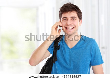 Portrait of a casual young man speaking on the phone