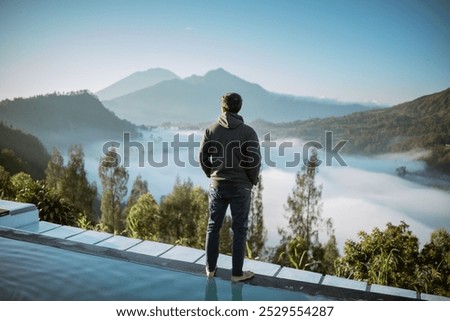 Similar – Foto Bild Tourist mit Blick auf Bergwasserfall