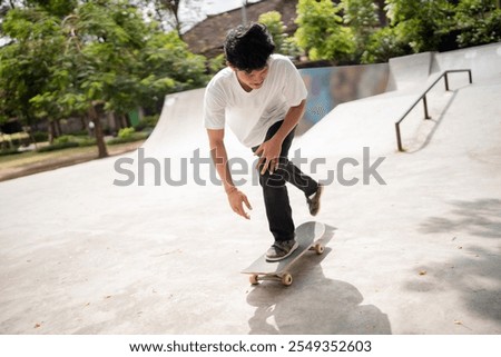 Similar – Image, Stock Photo Skater performing trick on ramp in skate park