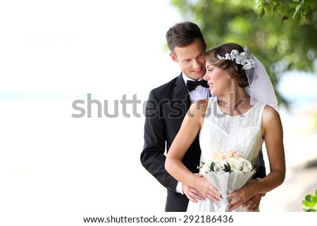 portrait of beautiful bride and handsome groom happy together with copy space