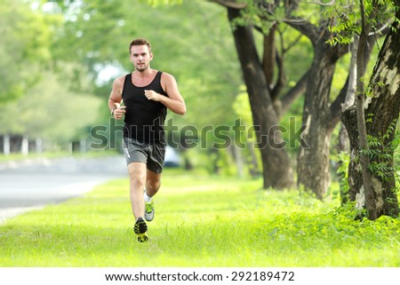 portrait of male runner training for marathon with copy space