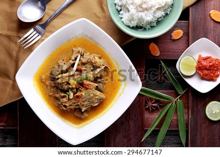 top view portrait of indonesian food gulai kambing served with rice