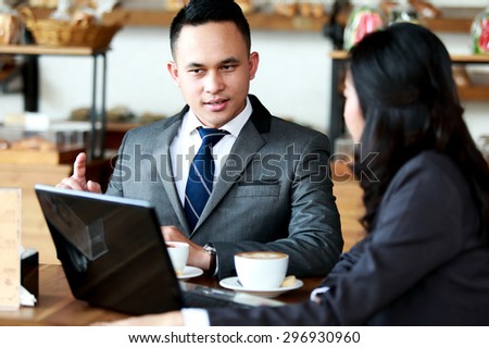 portrait of two business people meeting at coffee shop