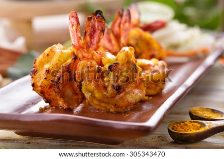 close up portrait of spicy indian tandoori prawn