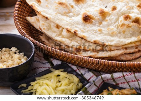 close up portrait of indian naan bread and paneer