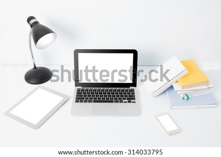 portrait of modern creative workspace on white background and white desk