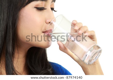 beautiful woman drinking water in isolated white background