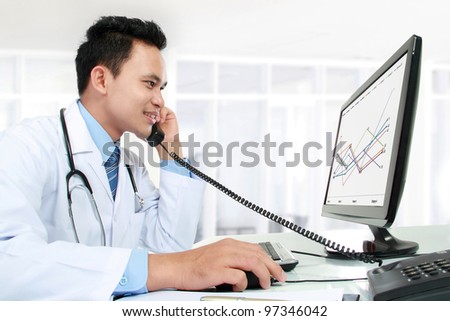 portrait of medical doctor working with his computer