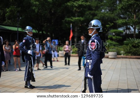TAIPEI - OCT 1 : Guards at the Martyr\'s Shrine in Taipei, Taiwan, on their way out after being relieved of their turn guarding the shrine. OCT 1, 2012 in Taipei, Taiwan.
