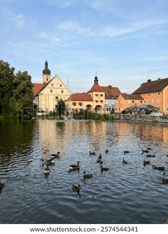 Similar – Foto Bild Ruhiger See und Stadt in der Nähe der Berge