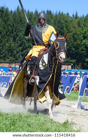 AGASUL - AUGUST 18: Knight on the horse taking part in tournament reconstruction near Kyburg castle on August 18, 2012 in Agasul, Canton Zurich, Switzerland.