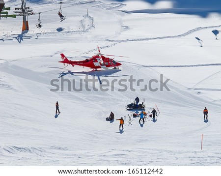 FLUMSERBERG - FEBRUARY 21: The rescue helicopter evacuates skiier after heavy accident, Flumserberg, Switzerland on February 21, 2010. Skiing safety becoming an issue on crowded slopes.