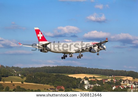 ZURICH - JULY 18: Airbus A-330 landing in Zurich airport after long haul flight on July 18, 2015 in Zurich, Switzerland. Zurich airport is home port for Swiss Air and one of the biggest european hubs.