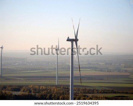 Similar – Image, Stock Photo View on several windmills, wind generators, turbines, producing renewable clean energy by converting kinetic energy