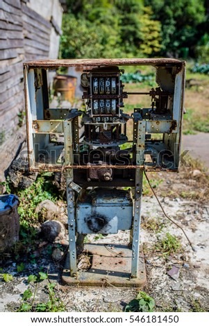 Similar – Image, Stock Photo Old dilapidated fuel pump for liquid fuel in detail with reflection of a blue oh so environmentally friendly xyz car