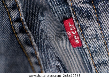 London, England, May 10, 2010: Close-Up of Red Label Logo and Stitching on Back Pocket of a pair Levi\'s Jeans