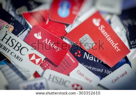 London, England - July 29, 2015: Cut Up Credit and Debit Cards, As the credit crunch bites people are finding it harder to pay back credit card bills
