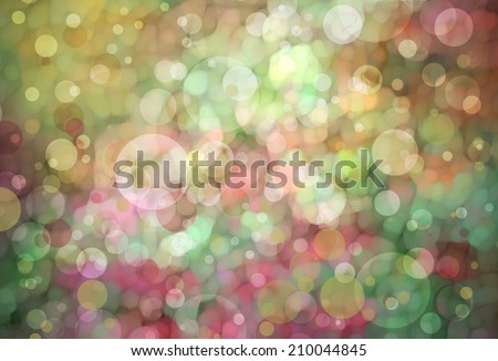 Beautiful green bokeh background with shimmering pink gold yellow colors and white lights Festive party background. Fantasy night or magical glitter background sparkles