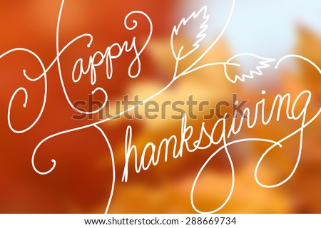 Happy Thanksgiving text design on blurred orange maple leaves