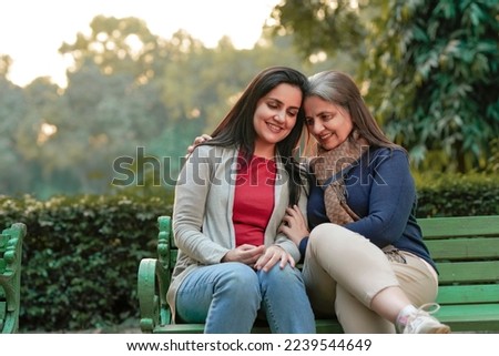 Similar – Image, Stock Photo Mother and daughter sit in the Lotus position in the garden. The family practices yoga outdoors. Back view, space for text