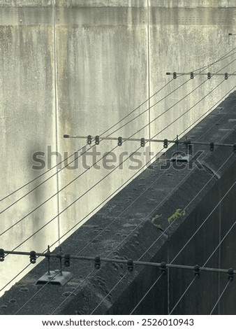 Similar – Foto Bild Reihen von Stacheldraht im Hintergrund ein verlassenes Wohngebäude mit zerbrochenen Fenstern. Konzept von Geisterstadt, Isolation und Sicherheit. Gefängnis, Flüchtling, Einsamkeit