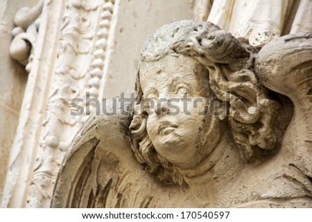 Angel sculpture on the facade of Cathedral of Lecce. Puglia. Italy