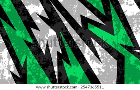 Abstract green, black, gray, and white jagged shapes create a grungy, dynamic pattern with sharp angles and a distressed texture.