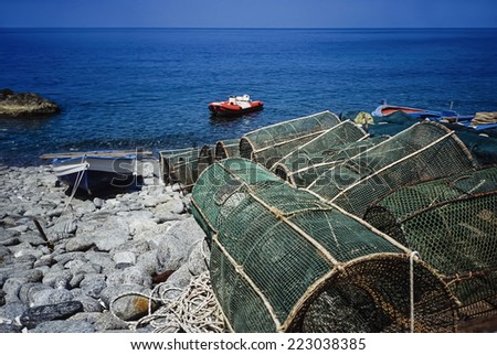 Italy, Calabria, Tyrrhenian Sea, wooden fishing boats and fish traps ashore - FILM SCAN