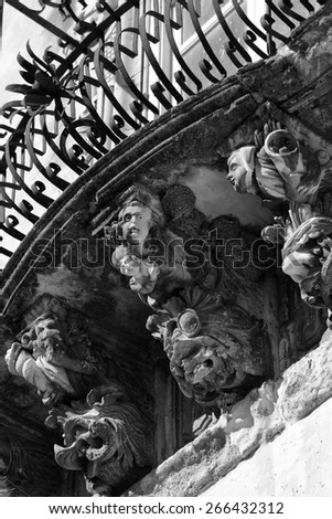 Italy, Sicily, Ragusa Ibla, the baroque facade of Cosentini Palace (Unesco monument), ornamental statues under a balcony