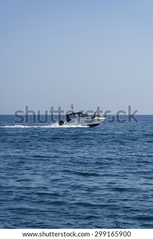 Italy, Mediterranean Sea; 18 july 2015, off the South-East sicilian coast, people cruising on a motor boat - EDITORIAL