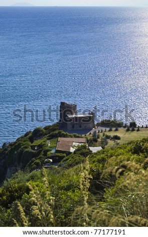 Italy, Tuscany, Tyrrhenian Sea, view of Talamone promontory, old house by the sea