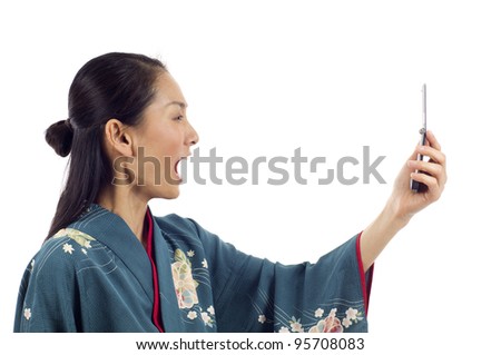 Angry Japanese woman in kimono yelling at her phone isolated over white background