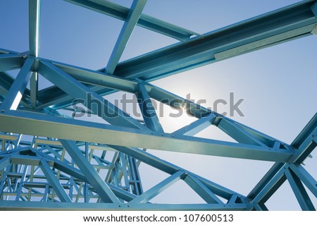 New residential construction home metal framing  against a blue sky