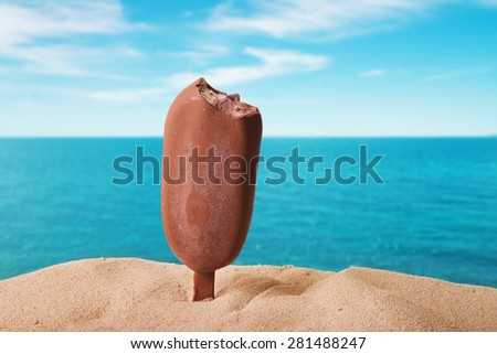classic chocolate ice cream with drops on the beach background