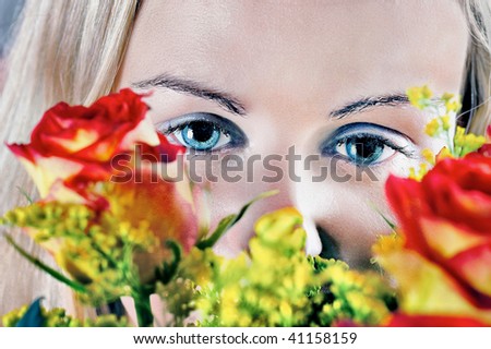 Girl and roses : Beautiful young woman\'s face fragment with colour roses over.
