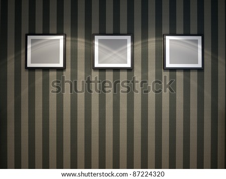 Three blank frames on wallpaper wall.