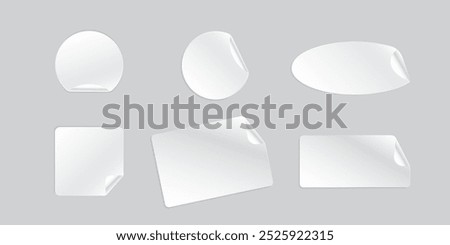 Adhesive round paper stickers with smooth edges in white, featuring a peeling corner effect and shadow. Includes plastic mockups with curved corners for a sleek and polished appearance.