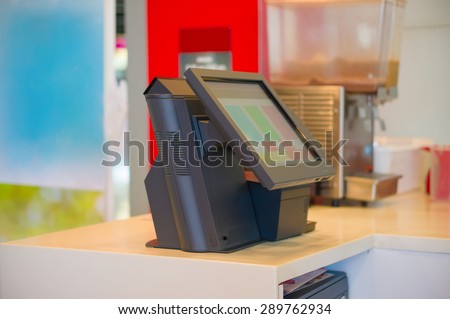 Empty cash desk terminal with computer touch screen in cafe