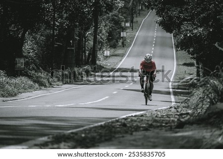 Similar – Image, Stock Photo Cyclist appears on the line from the airfield