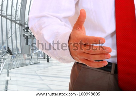 Businessman giving his hand for handshake