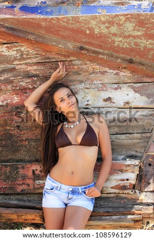 portrait of sexy woman with bikini jeans shorts