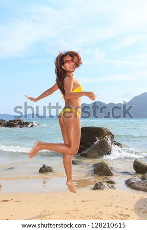 Thai model jumping on the beach  on the beach