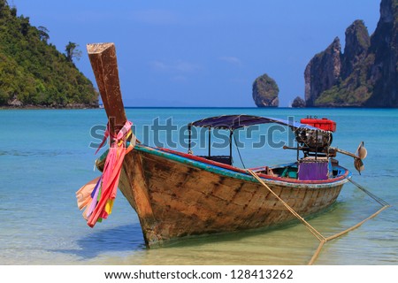 Long tailed boat Ruea Hang Yao on the beach at Holidays sunny tranquil paradise beach on Phi Phi island
