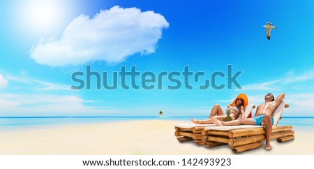Portrait Of Happy Beautiful Couple Enjoying their summer holidays on a tropical beach