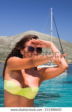 Young sexy woman a speed boat at sea