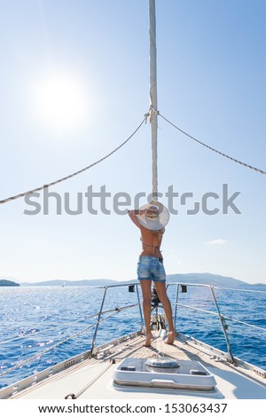 Young woman Sailing On Yacht in Greece