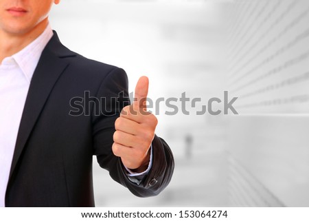 Business man thumb up positive sign
