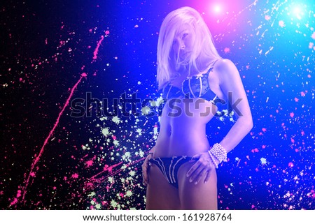 Sexy young blonde lady in night club
